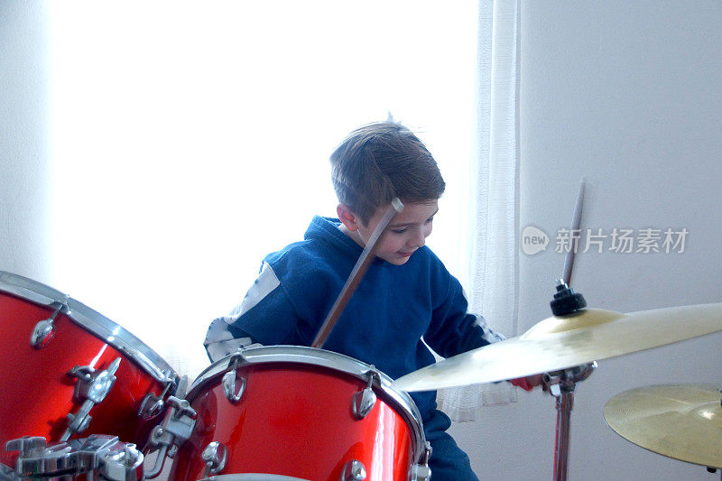 child playing drums